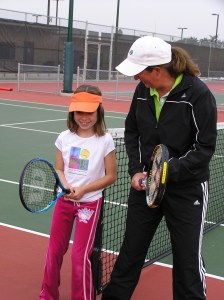 TracyKellyLaugh Girl learning tennis stance